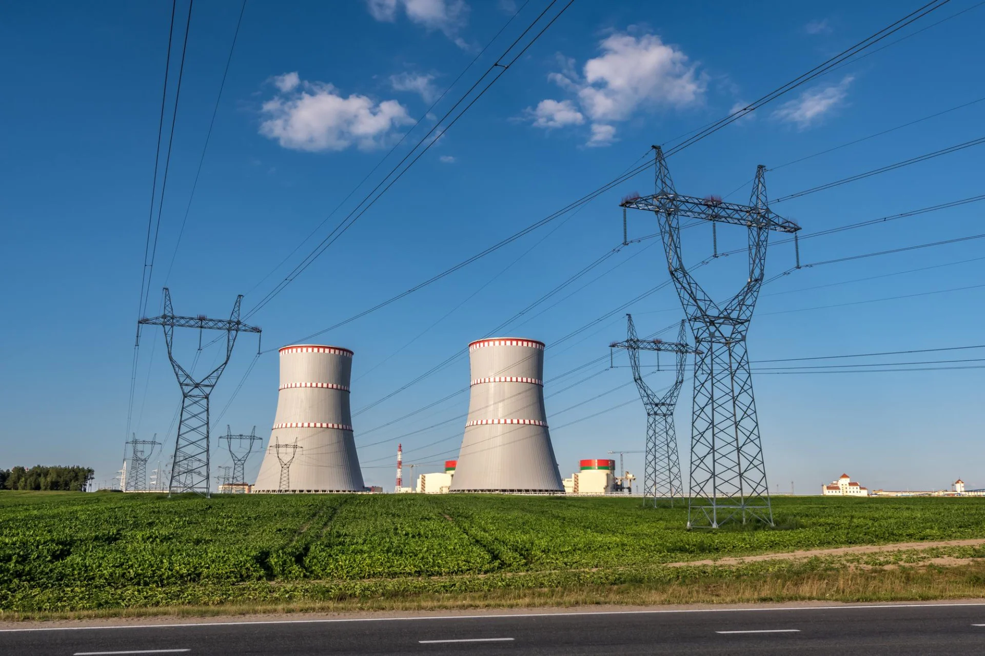 Projektové činnosti 4 ostrovec belarus july 2020 cooling towers nuclear power plant with high voltage electric pylon towers against blue sky